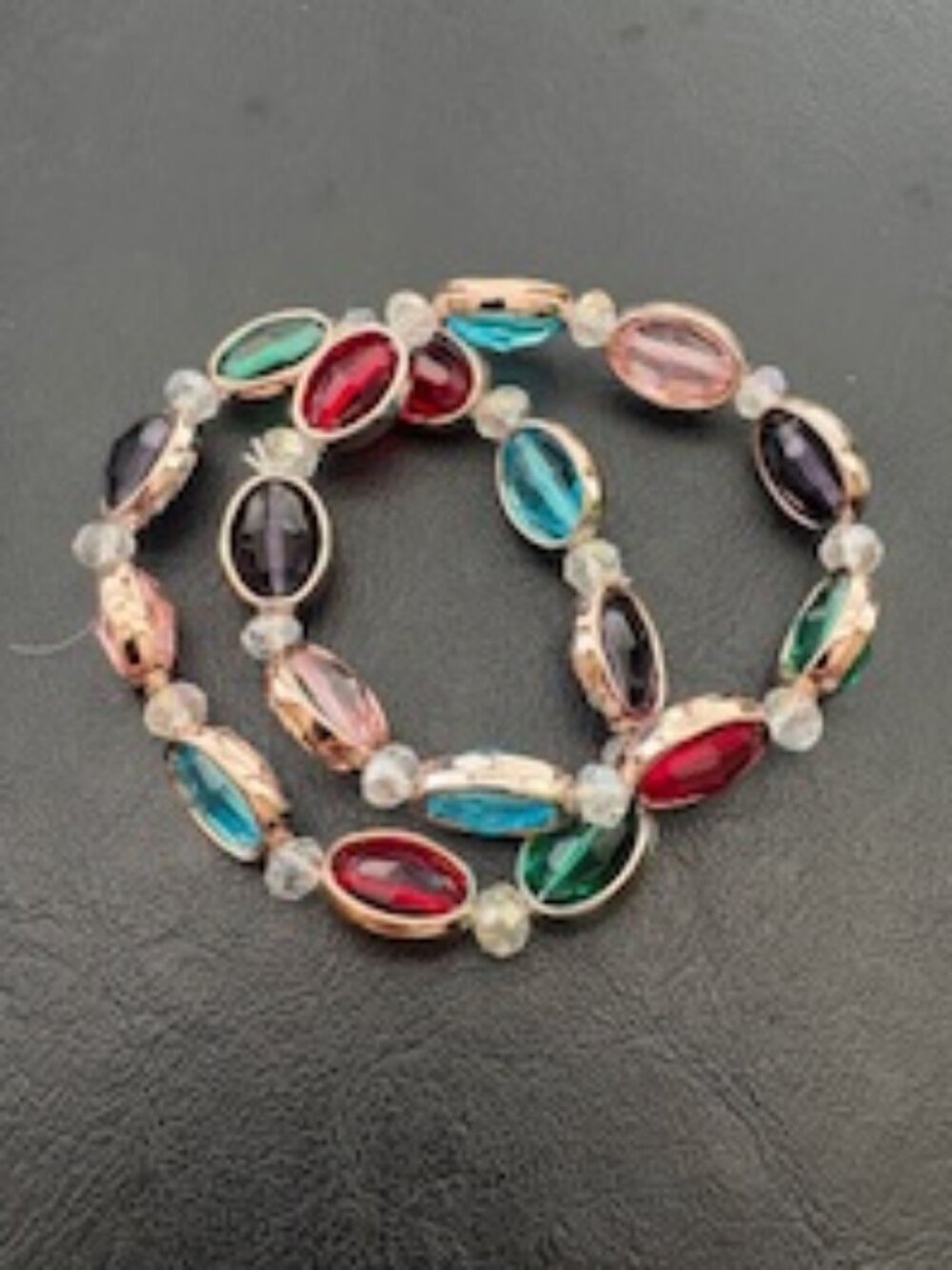 2 stretch bracelets-Oval shaped-Multi colored bezel set crystals-Gold tone
